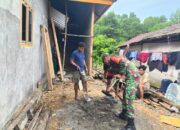 Babinsa Koramil 1311-02/Bungku Selatan Bantu Warga Bangun Rumah di Desa Sainoa