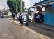 Babinsa Koramil Bahodopi Dampingi Pengukuran Pelebaran Jalan di Desa Labota