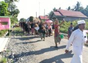 Bhabinkamtibmas Desa Laantula Jaya,Dampingi Warga dalam Prosesi Ngaben