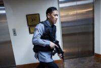 A member of the Senate security walks, after gunshots were heard at the Philippine Senate, as chaos mounted in anticipation of an attempt to arrest a top senator wanted by the International Criminal Court, in Pasay City, Metro Manila, Philippines, May 13, 2026. REUTERS/Eloisa Lopez