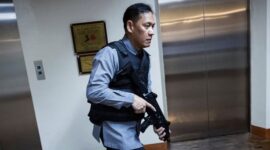 A member of the Senate security walks, after gunshots were heard at the Philippine Senate, as chaos mounted in anticipation of an attempt to arrest a top senator wanted by the International Criminal Court, in Pasay City, Metro Manila, Philippines, May 13, 2026. REUTERS/Eloisa Lopez